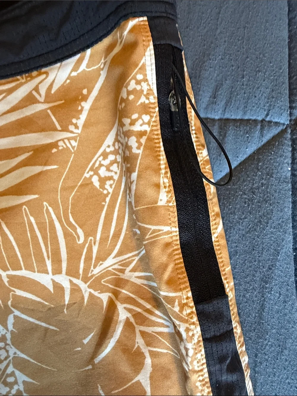 Vuori Board Swim Shorts (Black with light brown floral patterns)